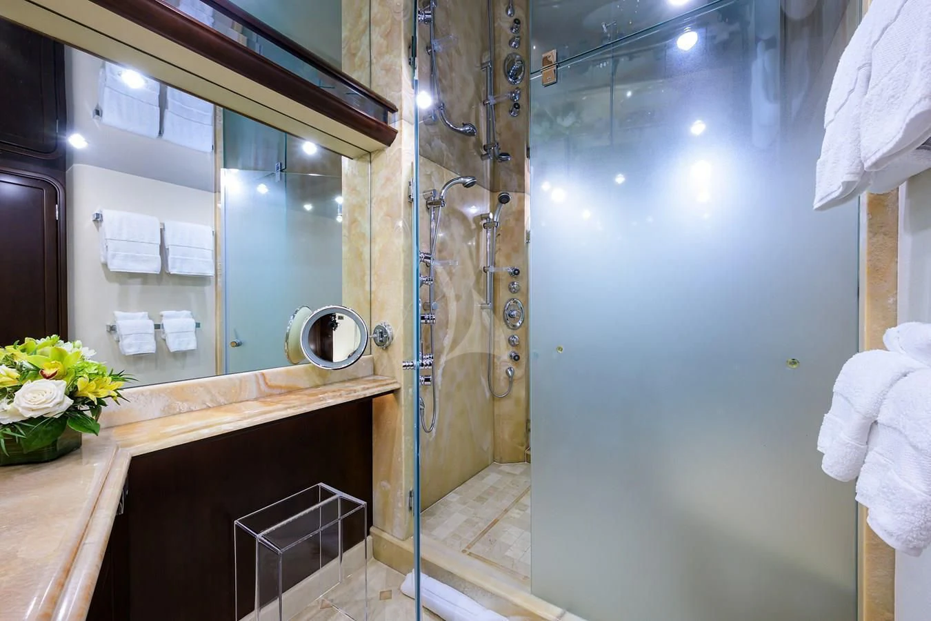 a bathroom with a large mirror aboard UNWINED Yacht for Charter
