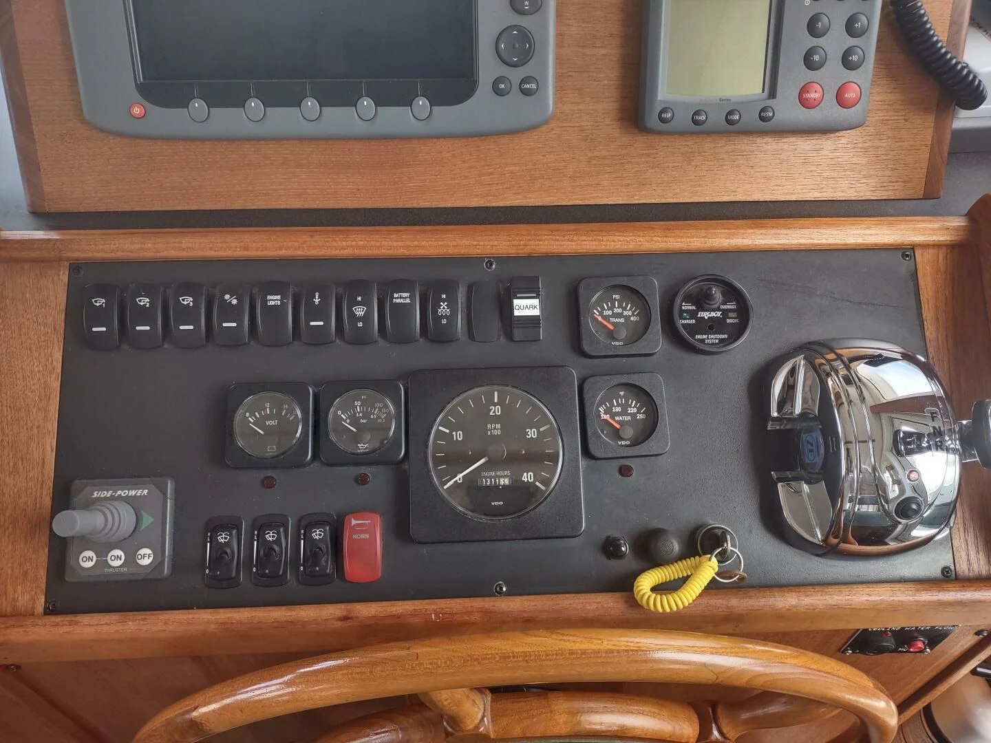 a black radio with a black screen aboard UNWINED Yacht for Charter