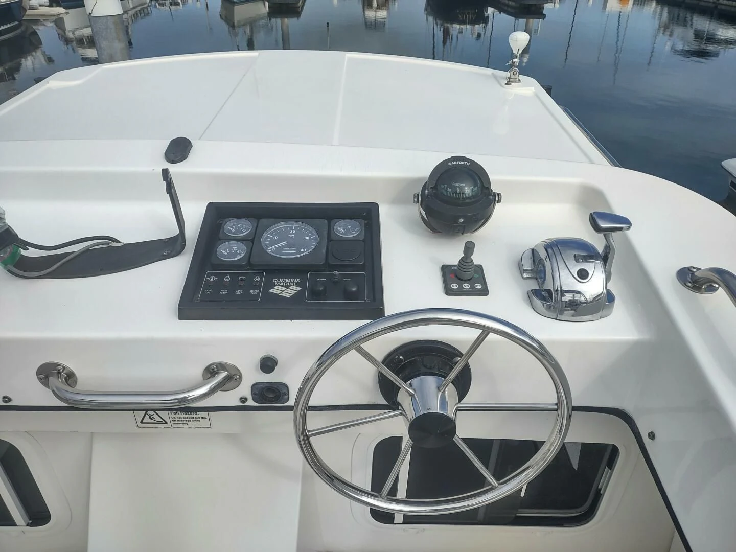 a white machine with a dial and a black dial aboard UNWINED Yacht for Charter