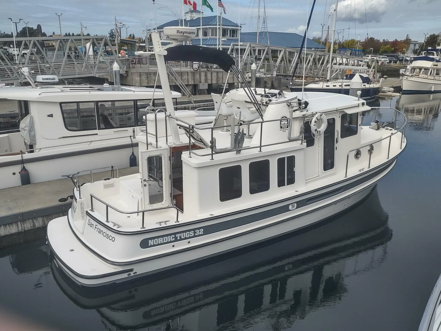 a boat docked at a pier aboard UNWINED Yacht for Charter