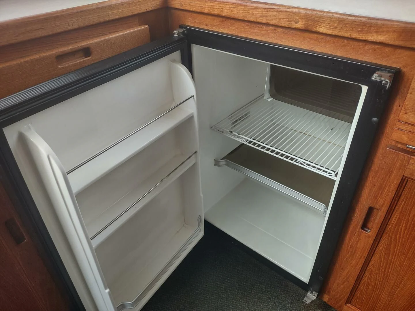 a kitchen with cabinets aboard UNWINED Yacht for Charter