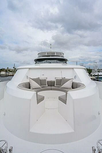a white building with a large white roof and a large boat on top aboard UNWINED Yacht for Charter