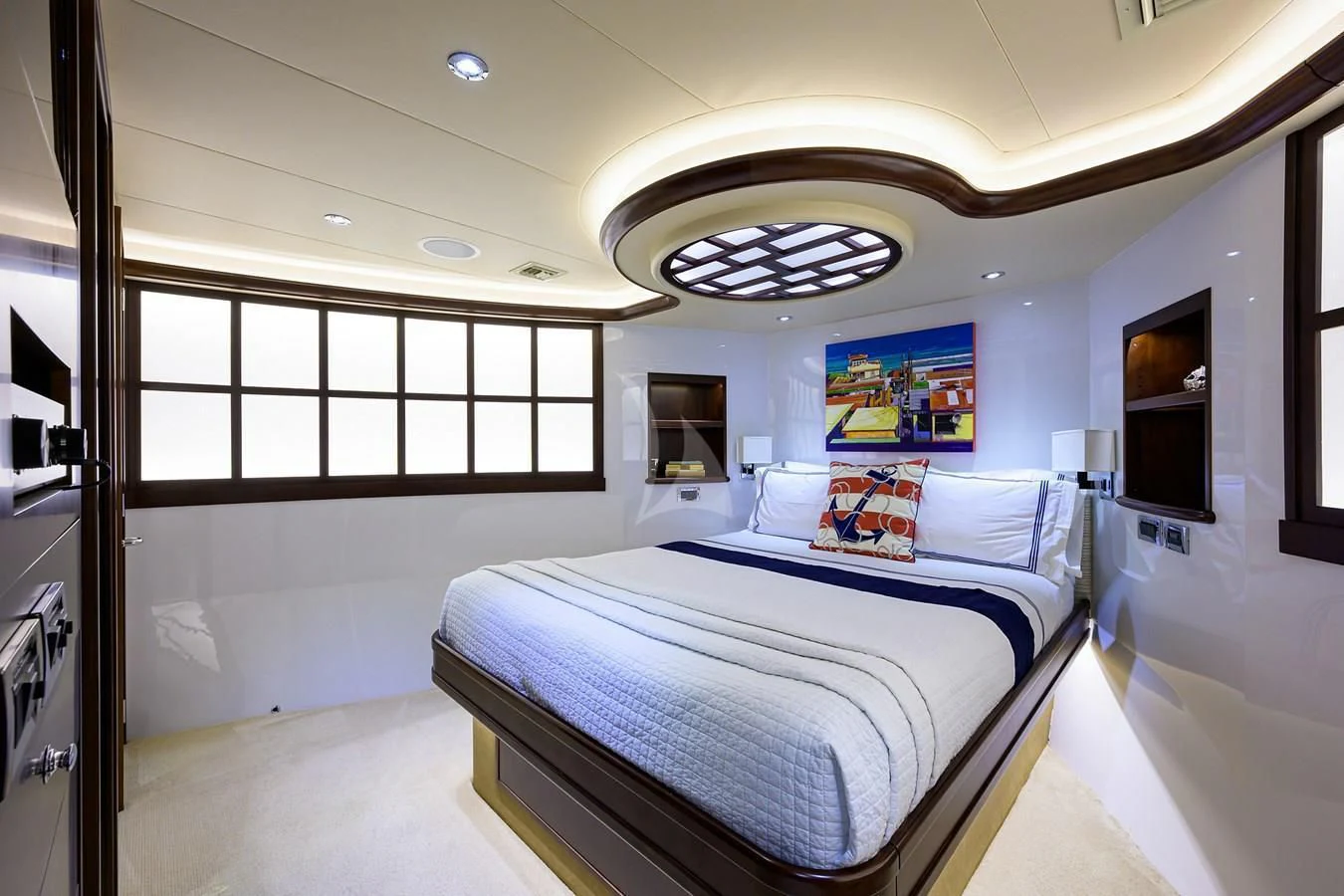 a bedroom with a large mirror aboard UNWINED Yacht for Charter
