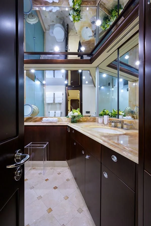 a bathroom with a large mirror aboard UNWINED Yacht for Charter