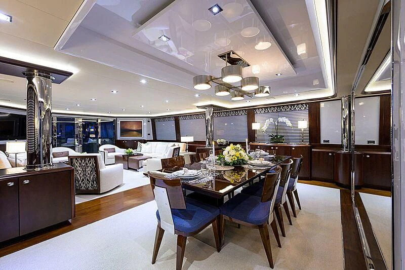 a large room with a table and chairs aboard UNWINED Yacht for Charter