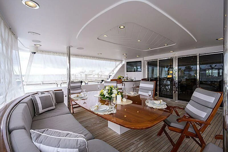 a living room with a couch and a table aboard UNWINED Yacht for Charter