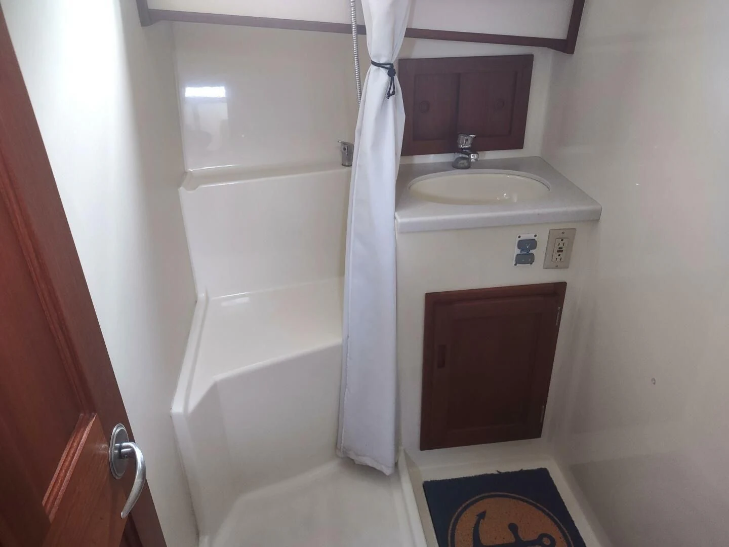 a sink and a towel on a rod aboard UNWINED Yacht for Charter
