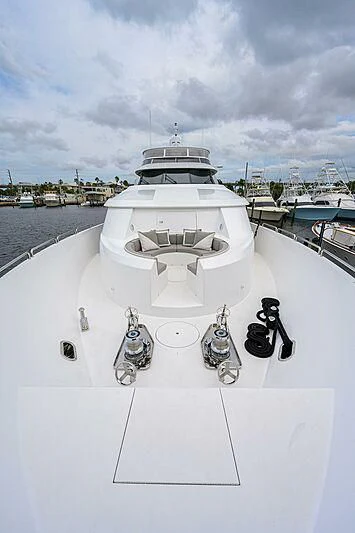 a white ship with a white ship and a couple of black and white boats on it aboard UNWINED Yacht for Charter