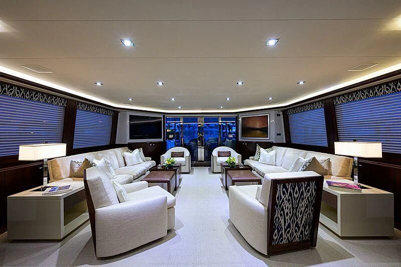 a living room with a large window aboard UNWINED Yacht for Charter