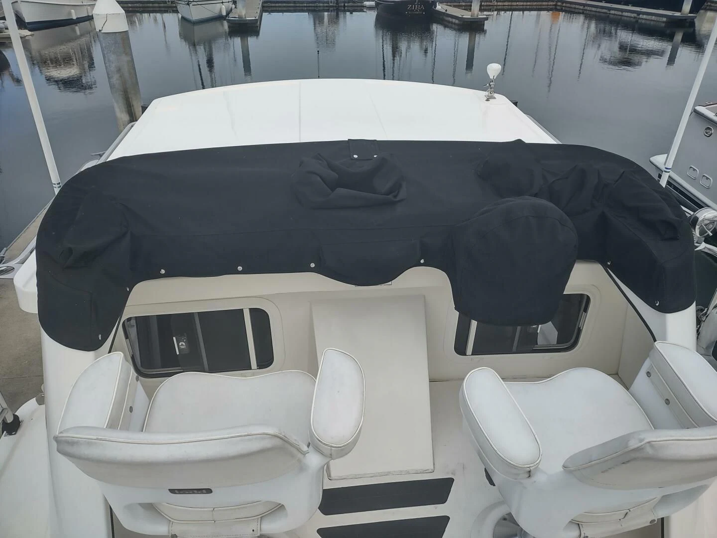 a black umbrella on a white car aboard UNWINED Yacht for Charter