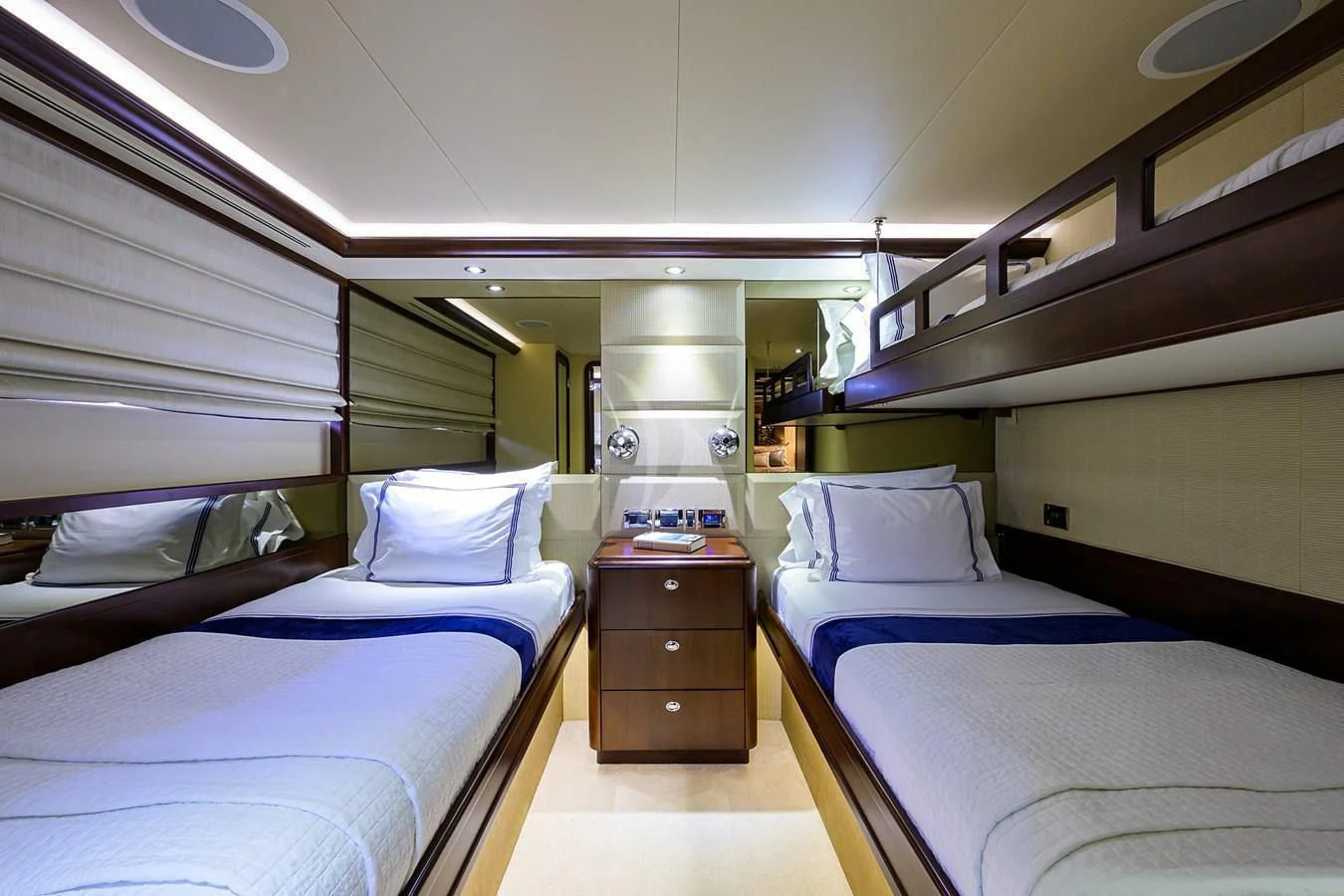 a room with beds and a window aboard UNWINED Yacht for Charter