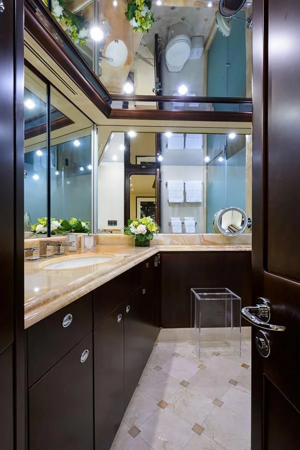 a bathroom with a large mirror aboard UNWINED Yacht for Charter