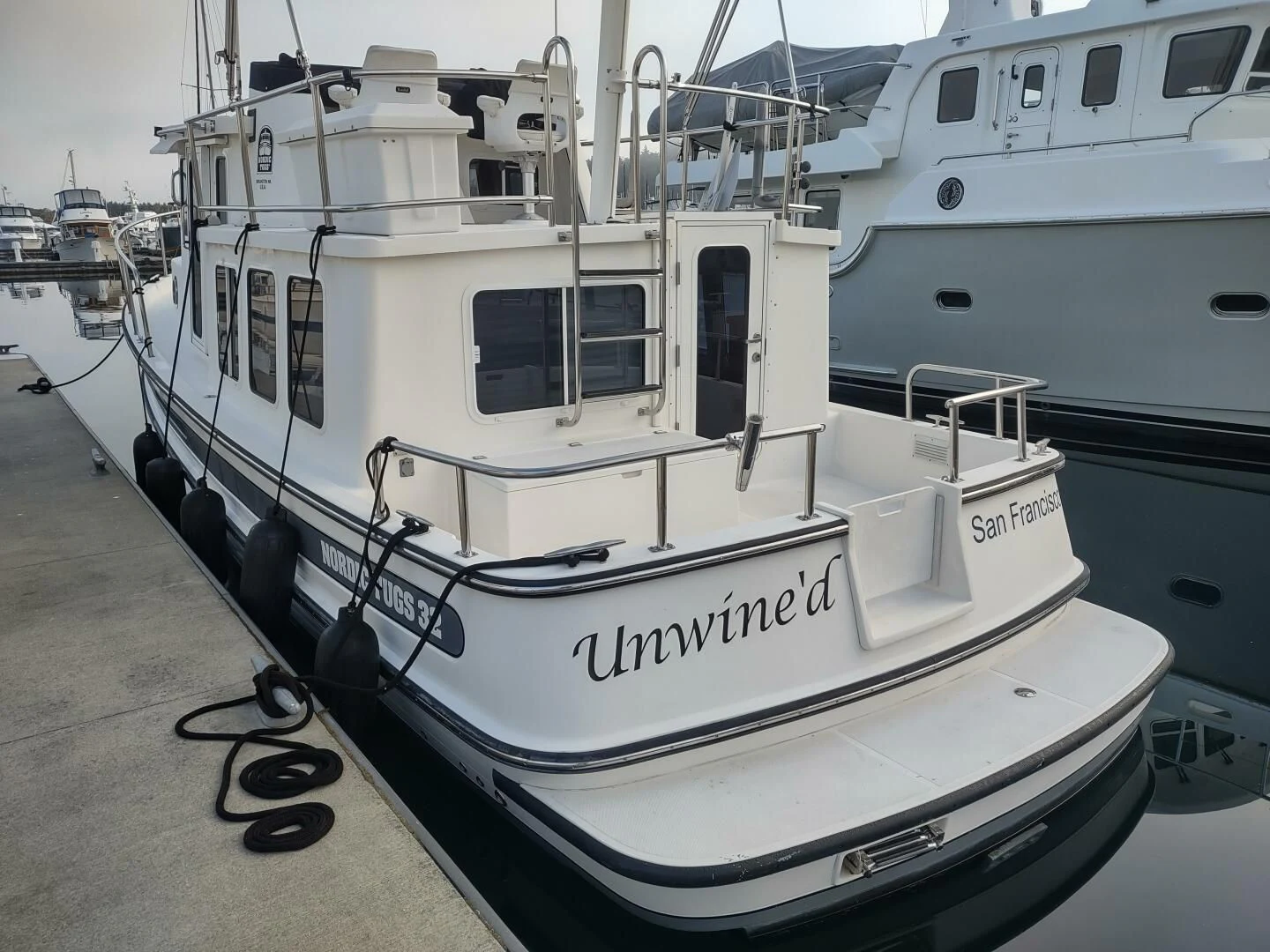 a boat parked on a dock aboard UNWINED Yacht for Charter