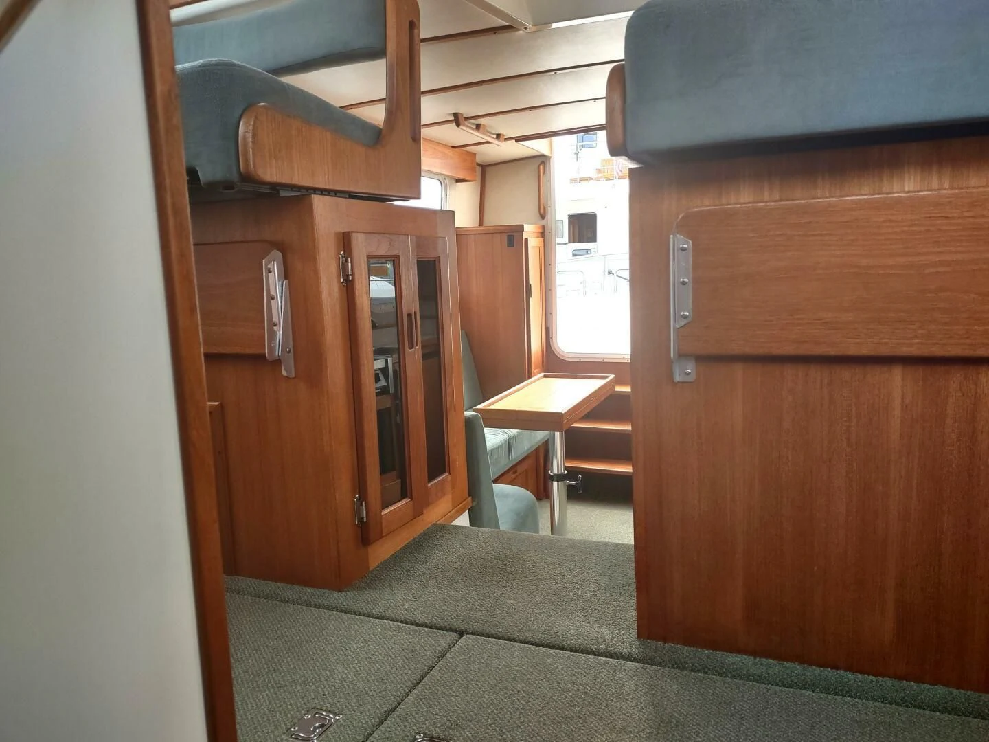 a room with wooden cabinets aboard UNWINED Yacht for Charter