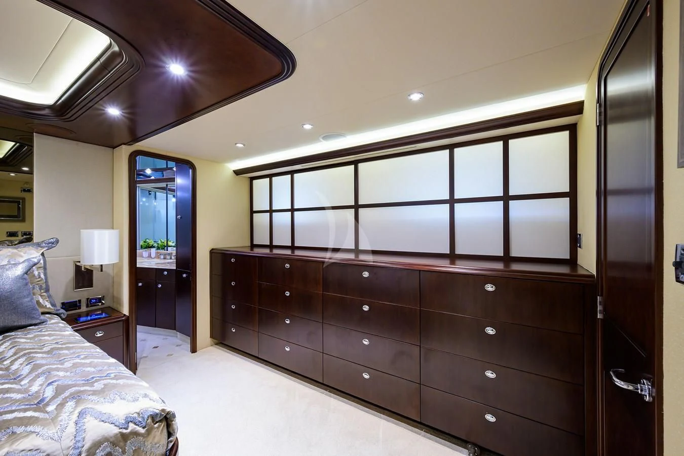 a bedroom with a large mirror aboard UNWINED Yacht for Charter