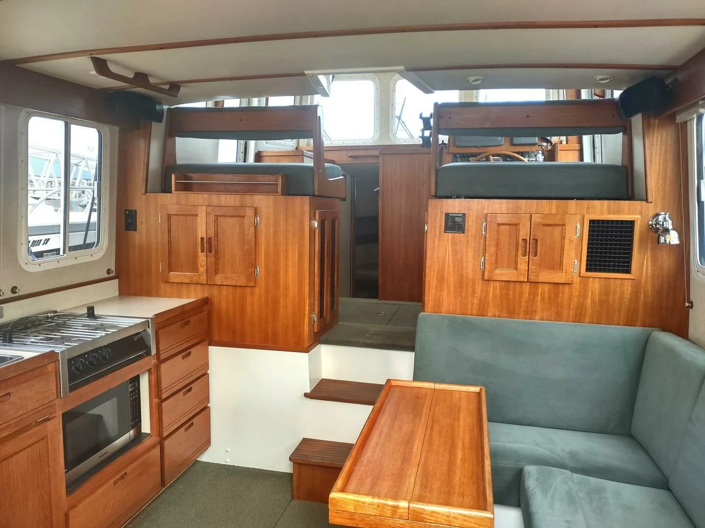 a living room with a couch and a table aboard UNWINED Yacht for Charter