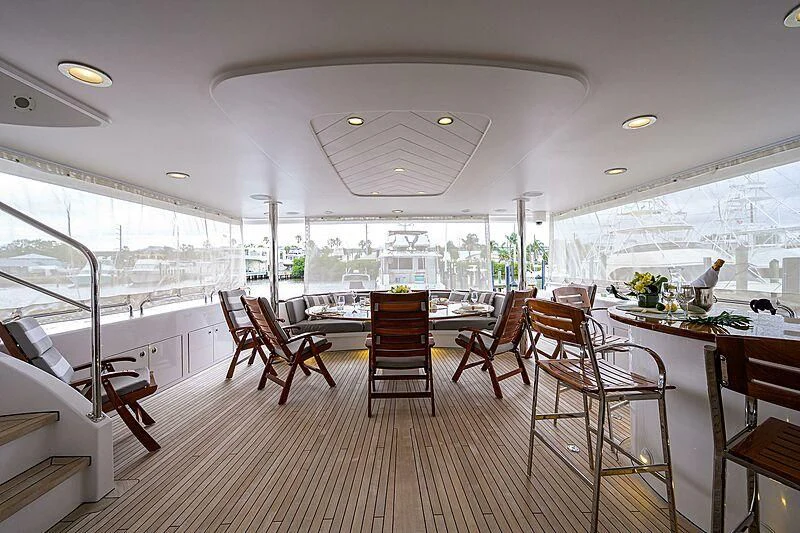 a large room with a table and chairs aboard UNWINED Yacht for Charter