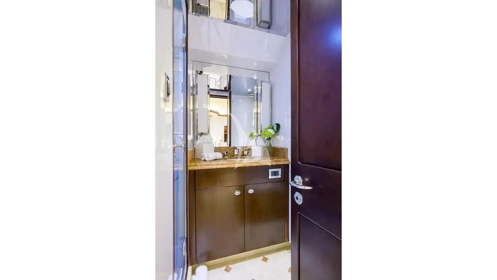 a kitchen with a cupboard and a sink aboard UNWINED Yacht for Charter