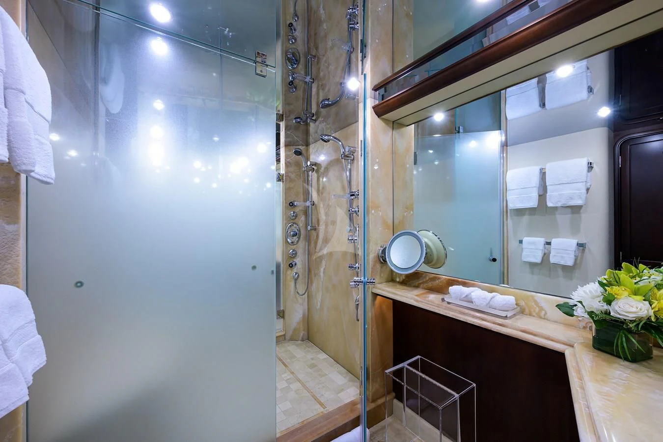 a bathroom with a large mirror aboard UNWINED Yacht for Charter
