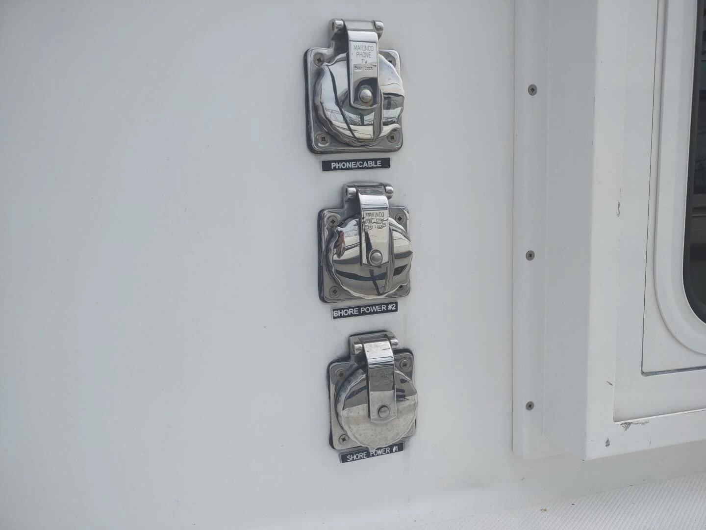 a wall with a door and a lock on it aboard UNWINED Yacht for Charter