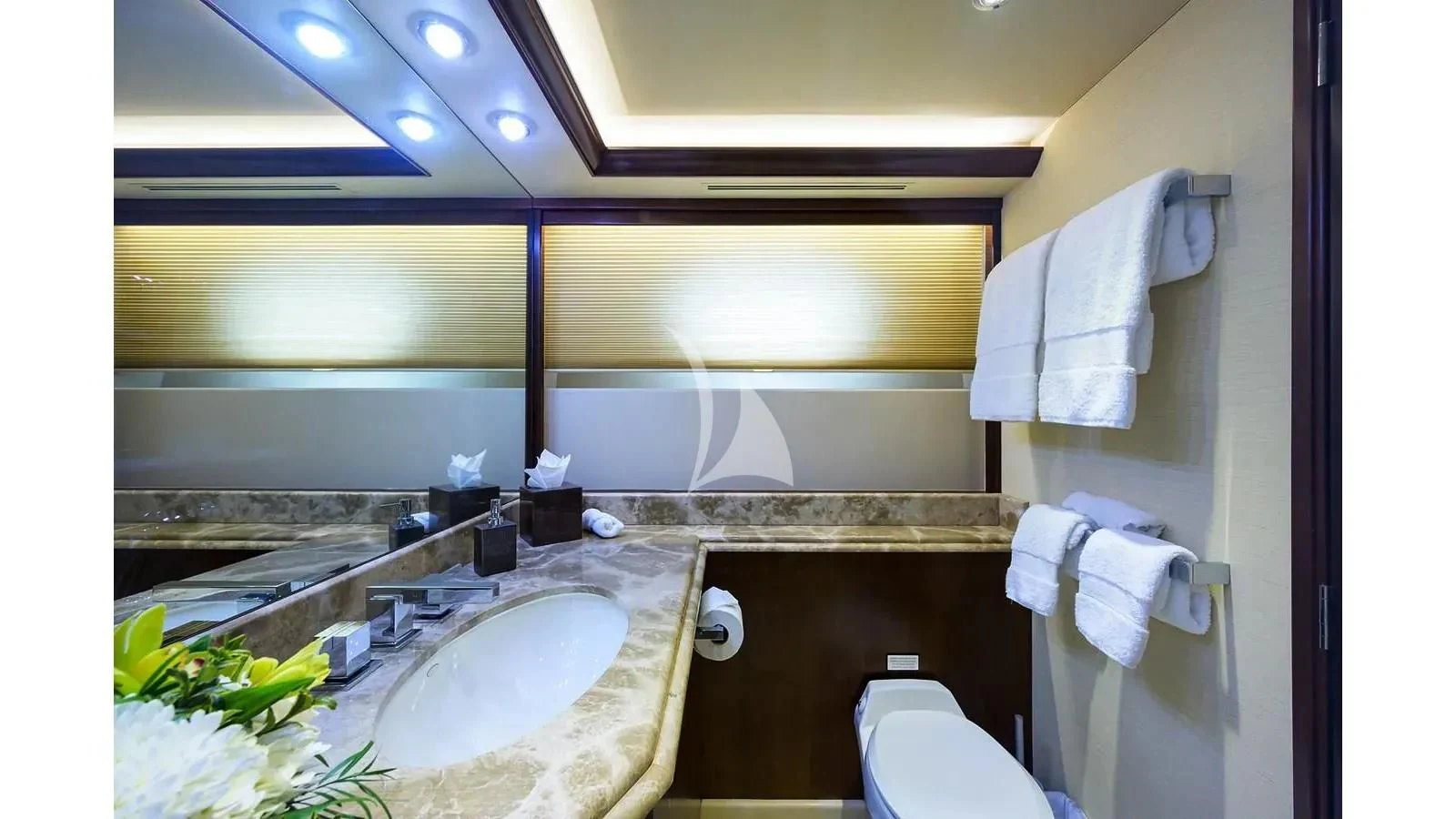 a bathroom with a sink and toilet aboard UNWINED Yacht for Charter