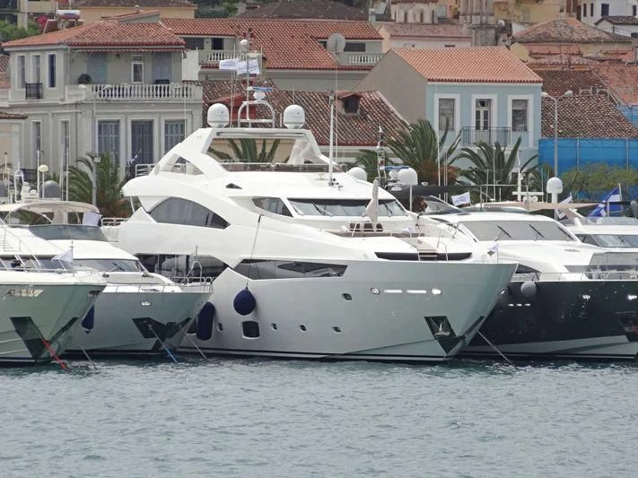 several boats docked at a pier aboard PATHOS Yacht for Sale