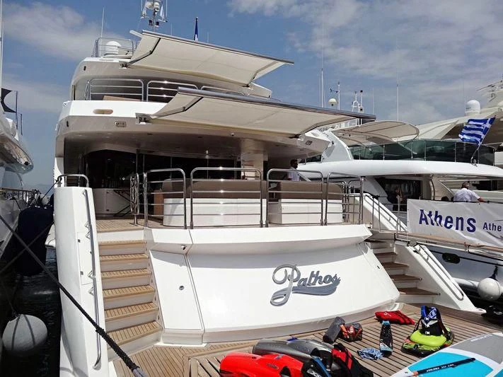 a boat docked at a port aboard PATHOS Yacht for Sale