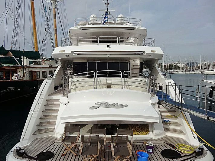 a large white boat docked aboard PATHOS Yacht for Sale