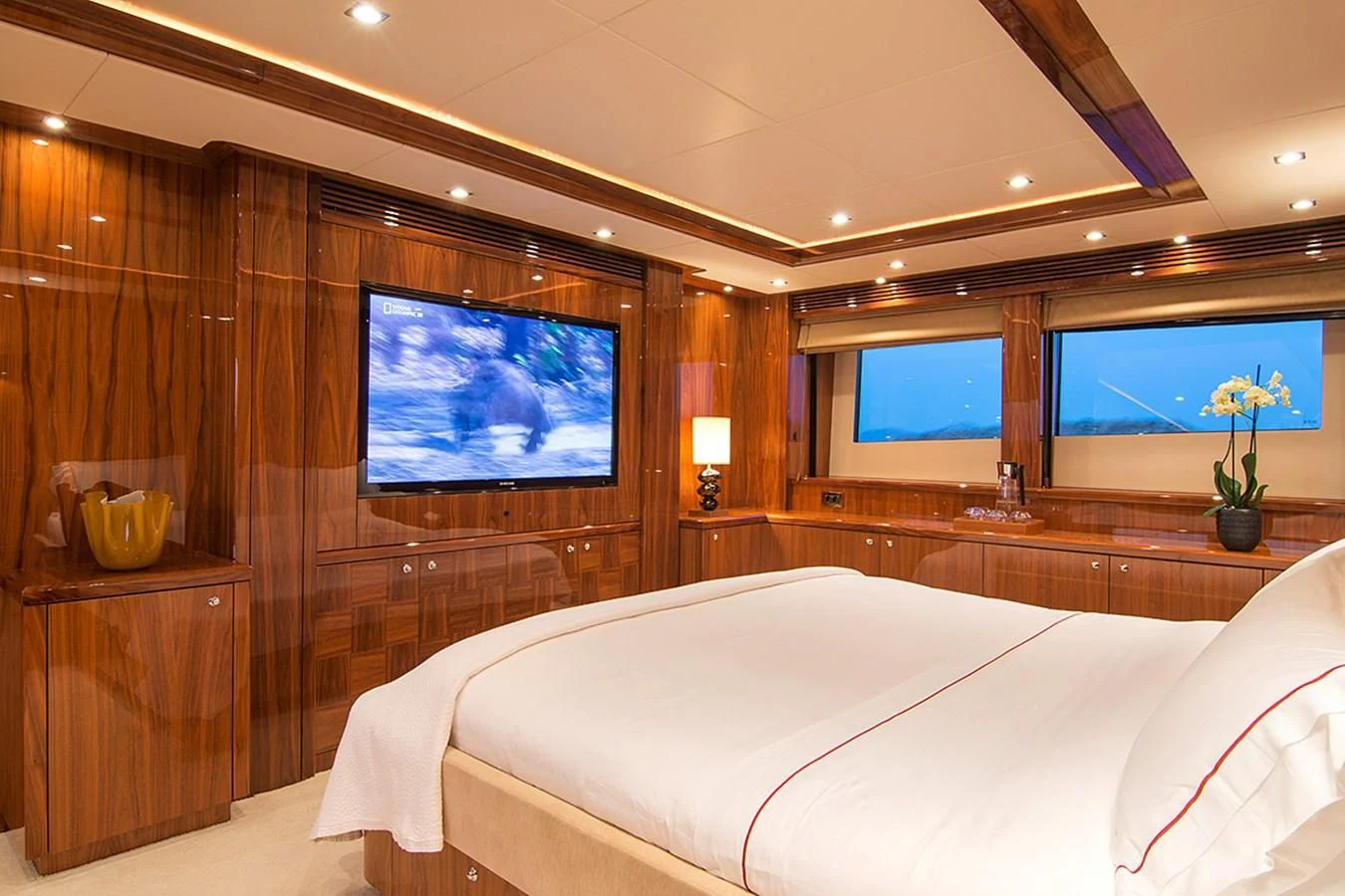a room with a bed and a tv aboard PATHOS Yacht for Sale
