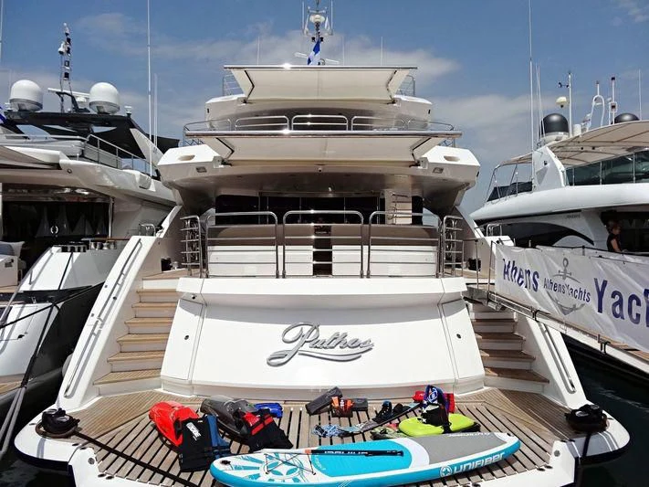 a large ship docked aboard PATHOS Yacht for Sale