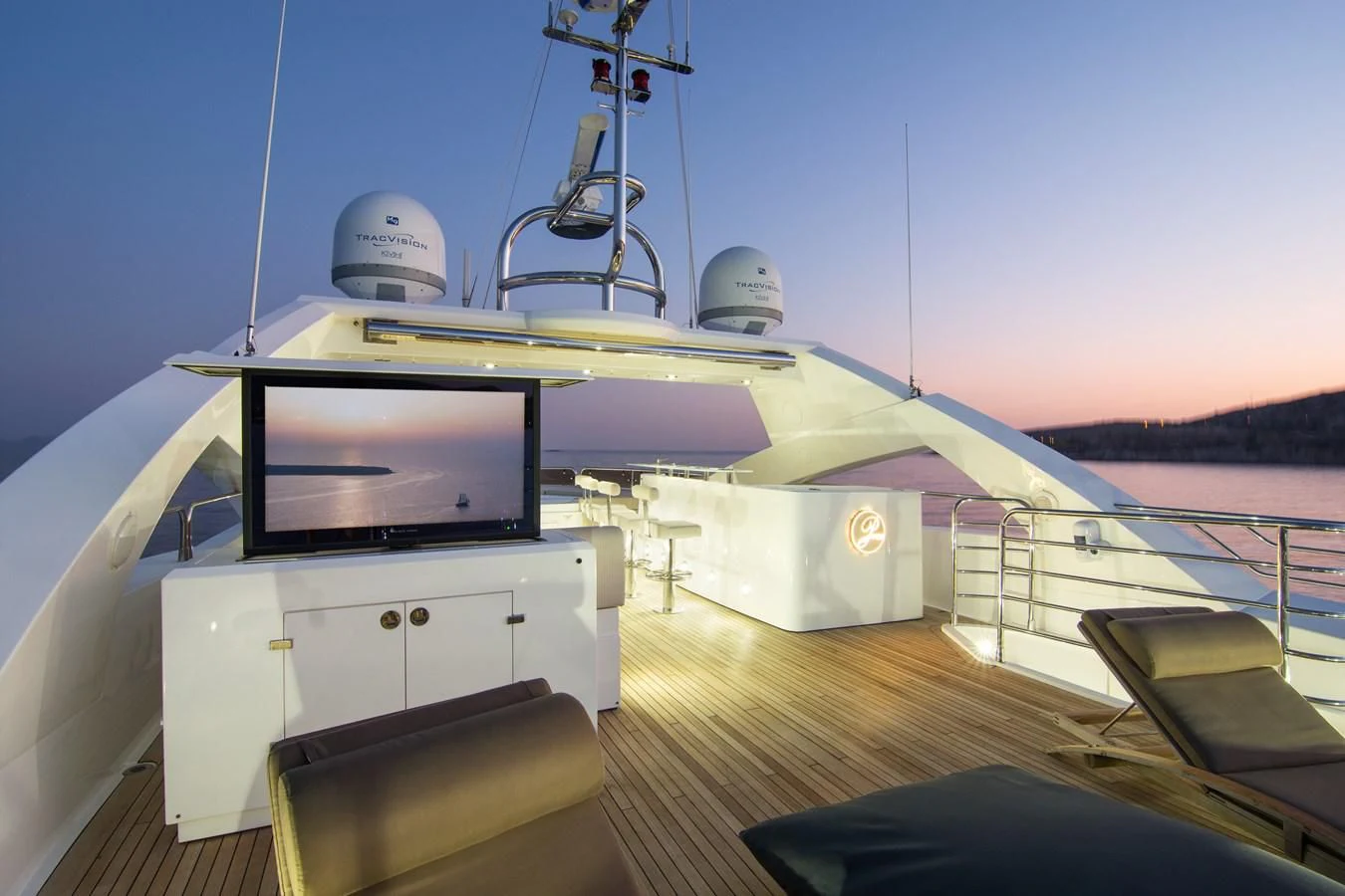 a large white boat with a television on it aboard PATHOS Yacht for Sale