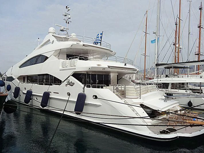 a white yacht in the water aboard PATHOS Yacht for Sale