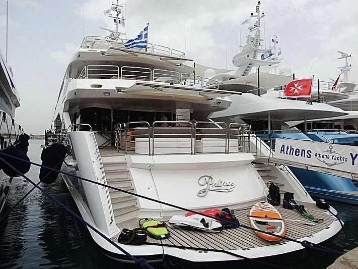a boat docked at a pier aboard PATHOS Yacht for Sale