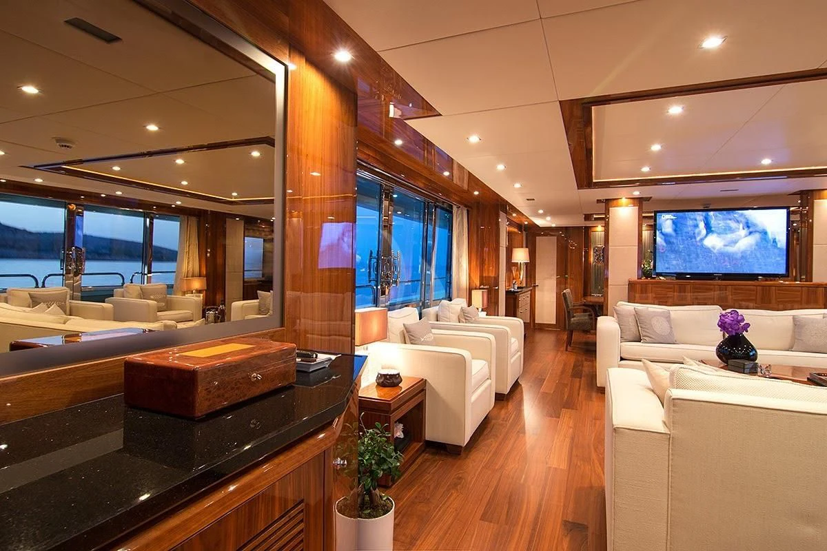 a living room with a large window aboard PATHOS Yacht for Sale