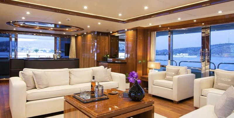 a living room with a large window aboard PATHOS Yacht for Sale