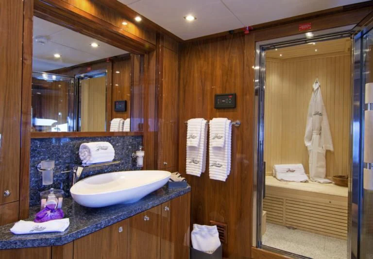 a bathroom with a sink and a mirror aboard PATHOS Yacht for Sale