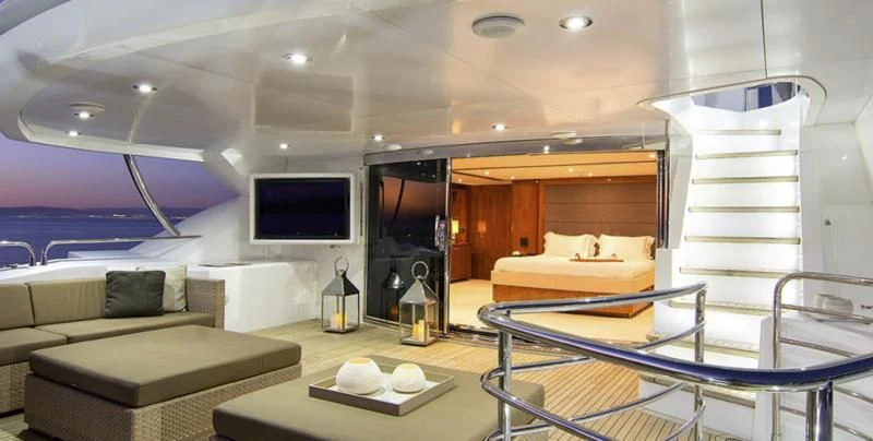 a room with a bed and a tv aboard PATHOS Yacht for Sale