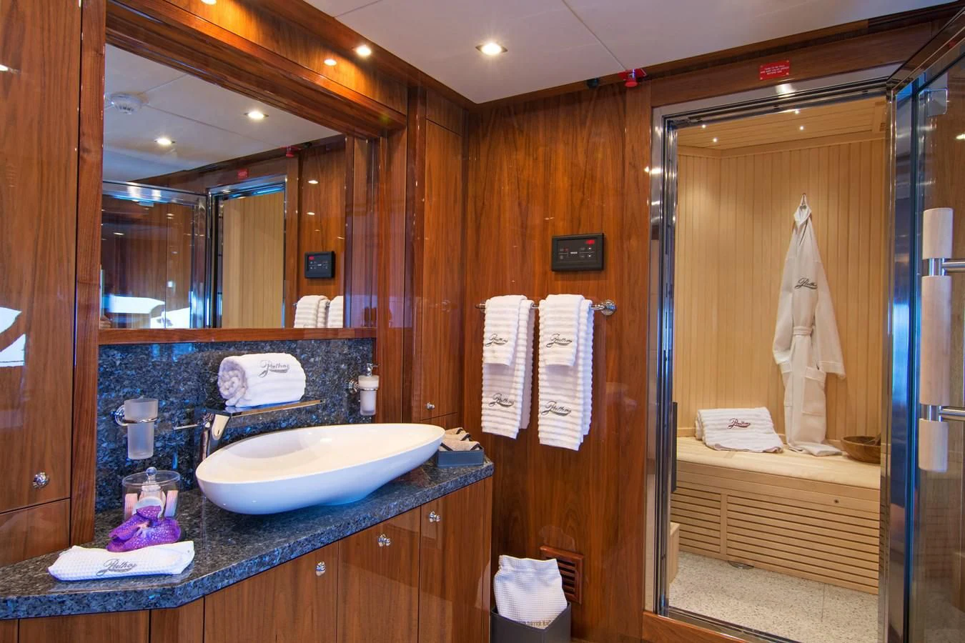 a bathroom with a sink and a mirror aboard PATHOS Yacht for Sale