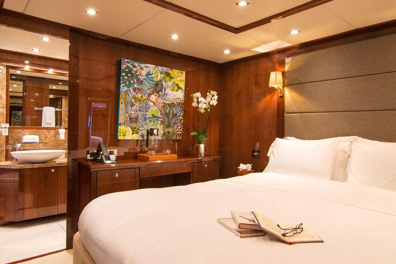 a hotel room with a large bed aboard PATHOS Yacht for Sale