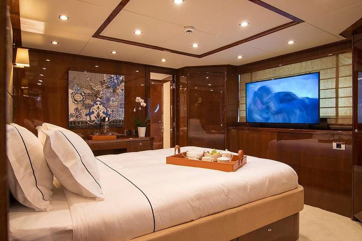 a large bed in a room aboard PATHOS Yacht for Sale