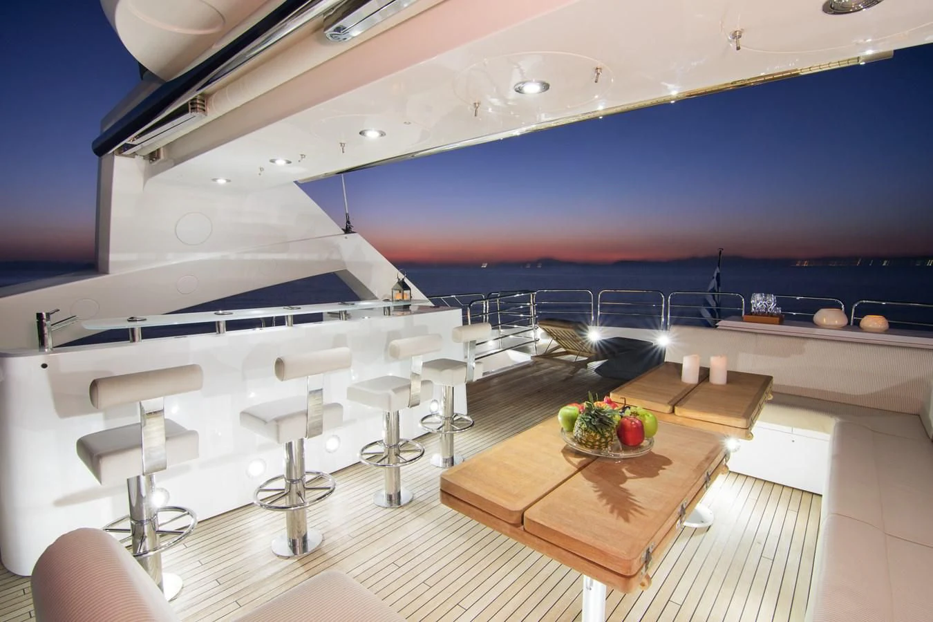 a room with a table and chairs aboard PATHOS Yacht for Sale