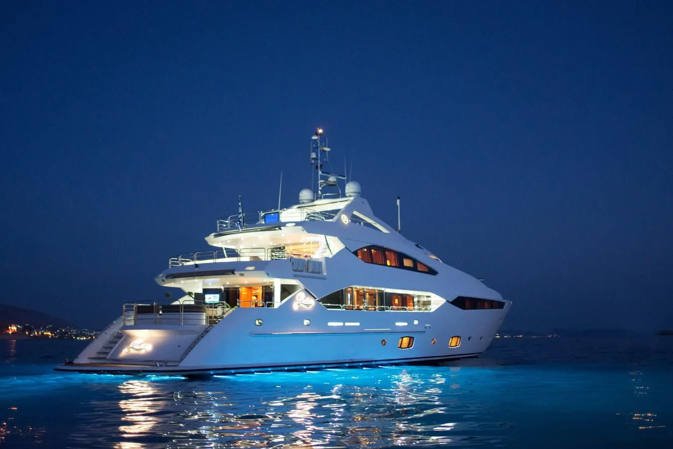 a large white boat in the water aboard PATHOS Yacht for Sale