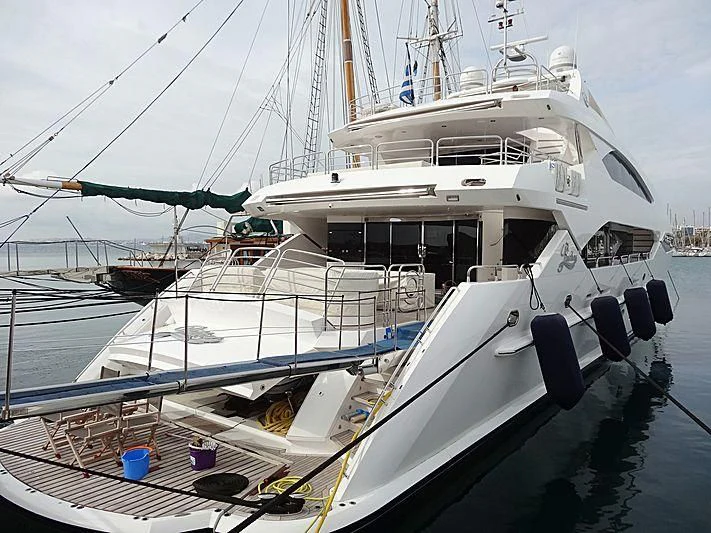 a large white boat docked aboard PATHOS Yacht for Sale