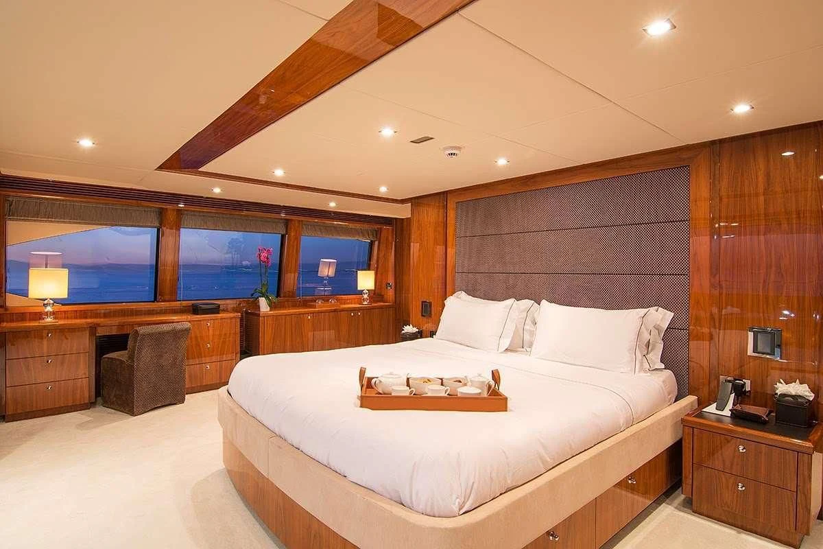 a large bed in a room aboard PATHOS Yacht for Sale