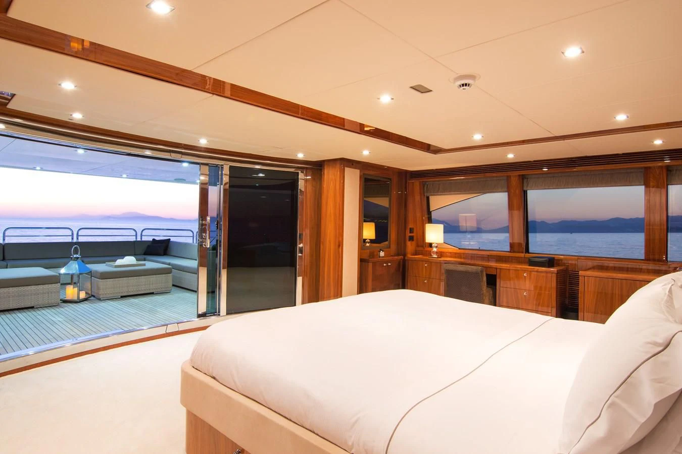a large hotel room with a large balcony aboard PATHOS Yacht for Sale