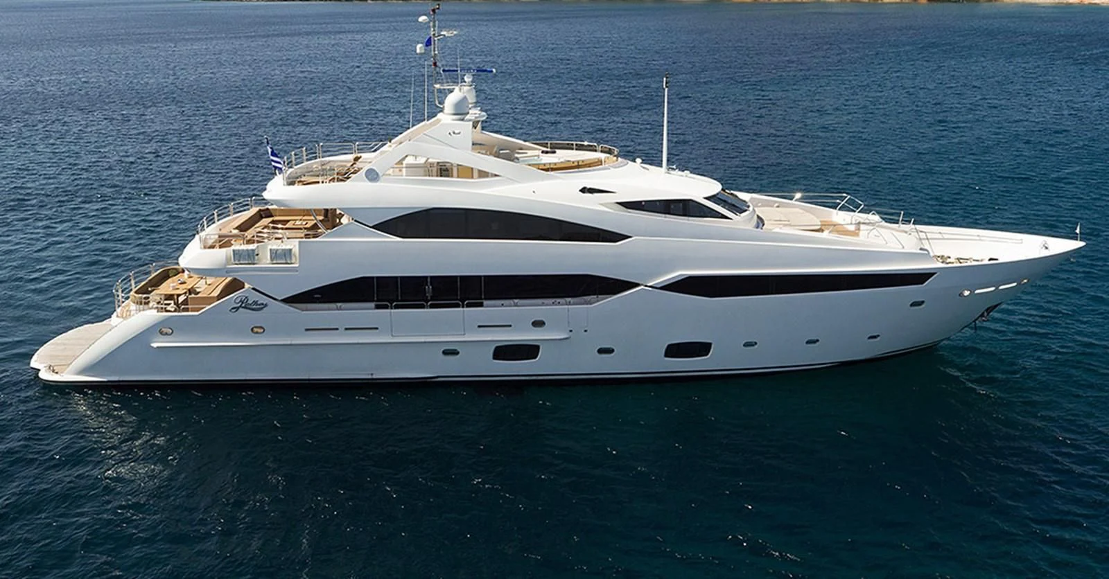 a white yacht in the water aboard PATHOS Yacht for Sale