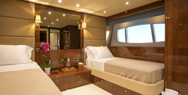a room with two beds aboard PATHOS Yacht for Sale