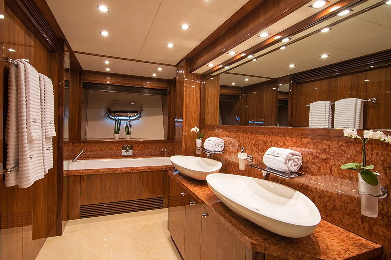 a bathroom with a large mirror aboard PATHOS Yacht for Sale