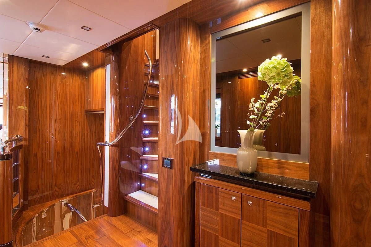 a wood cabinet with a plant in it aboard PATHOS Yacht for Sale