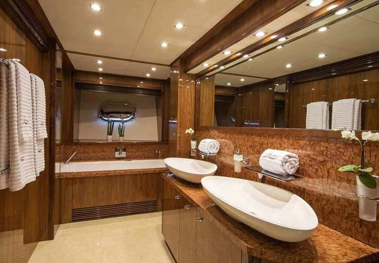a bathroom with a large mirror aboard PATHOS Yacht for Sale